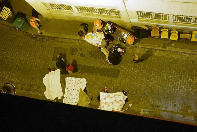 Bodies litter the streets of a Paris alley after a string of terror attacks in the French capital tonight.
