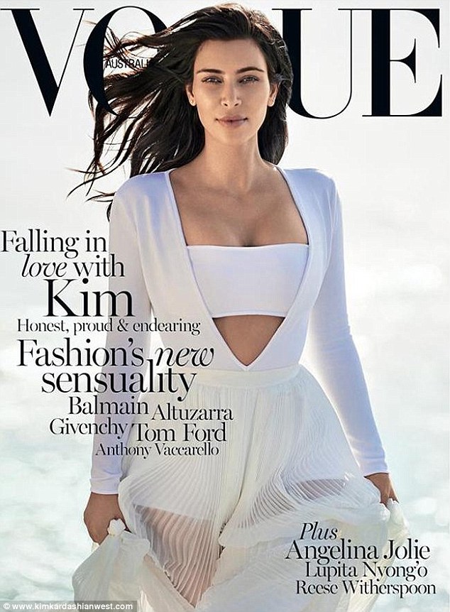 Getting it white: Australian Vogue was next. She had on a white tube top under a plunging dress. 'My February cover for Vogue Australia had such a cool, modern vibe,' the mother to North and Saint said 