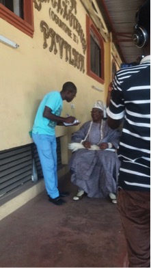 HRM, Oba of Ikorodu conducting his eye screening | Photo: SIGNAL