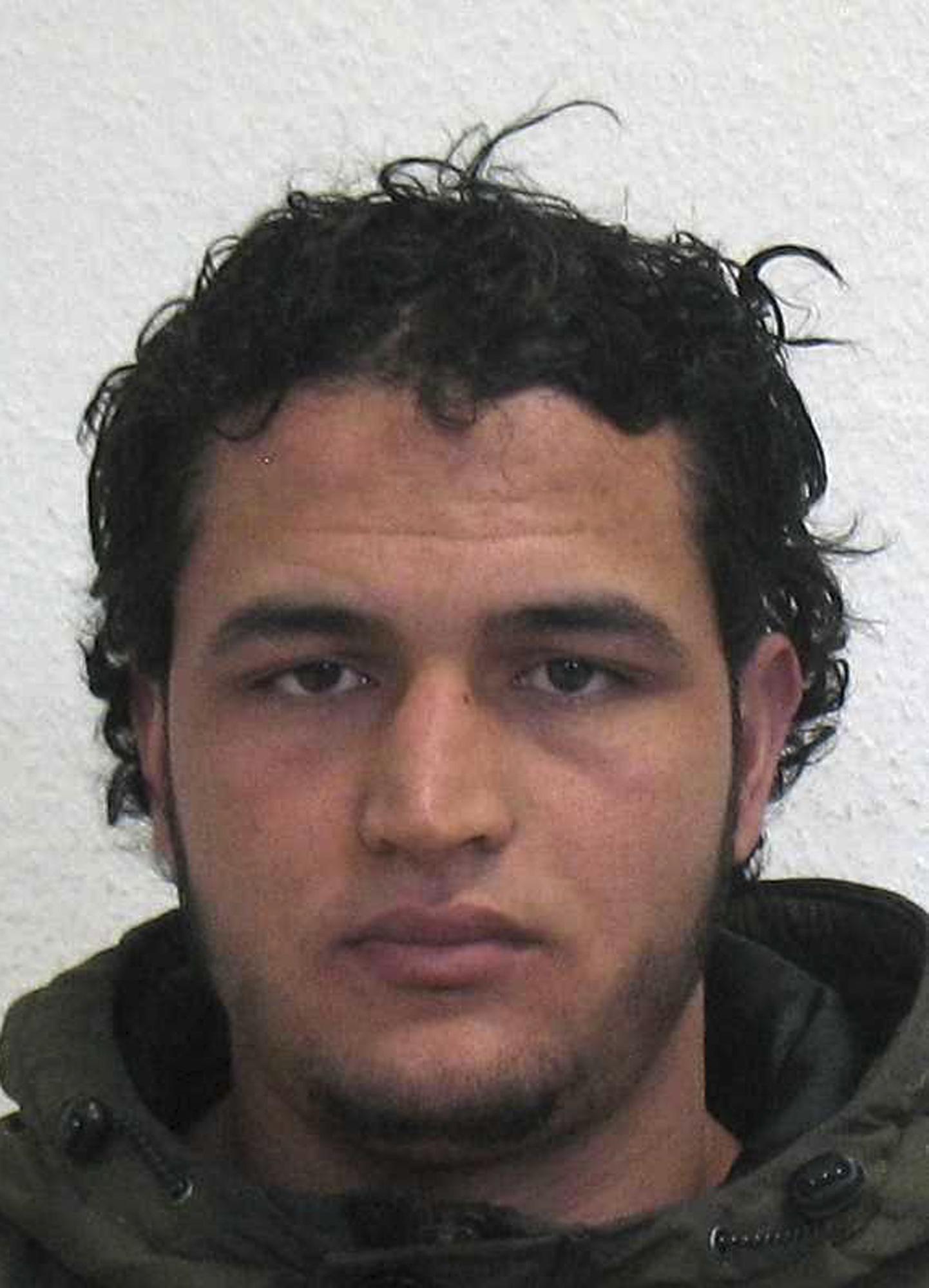 The wanted photo issued by German federal police on Wednesday, Dec. 21, 2016 shows 24-year-old Tunisian Anis Amri who is suspected of being involved in the fatal attack on the Christmas market in Berlin on Dec. 19, 2016. German authorities are offering a reward of up to 100,000 euros ($105,000) for the arrest of the Tunisian. (German police via AP) ORG XMIT: FOS804